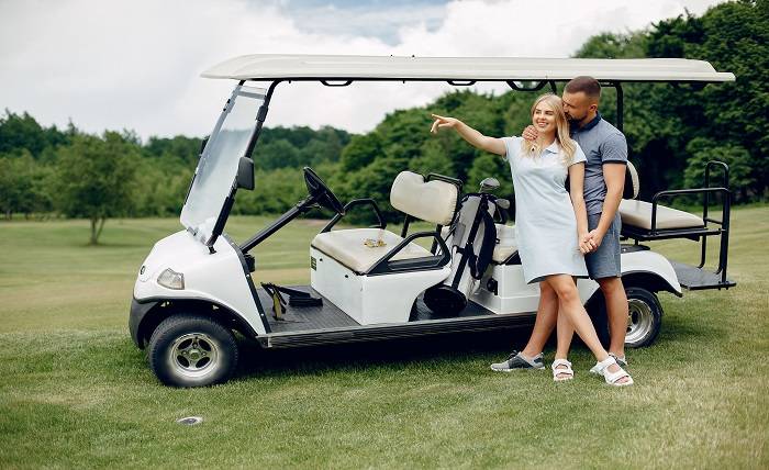 Towards a Sustainable Future with Electric Golf Carts: Benefits Beyond the Environment beautiful couple playing golf golf course