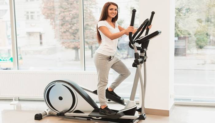 Choosing The Right Elliptical Machine: Factors To Consider Before Making A Purchase beautiful woman doing medical exercises stepper 23 2148328408 1