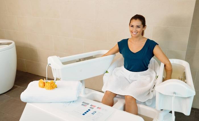 How Cryotherapy And Compression Combine For Optimal Healing happy woman relaxing arms legs hydrotherapy wellness center 637285 9483