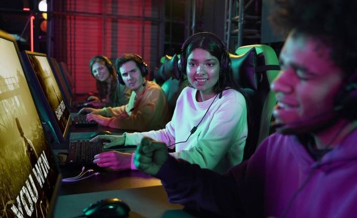 UFAGAME Provides Unmatched Value for Your Gaming Experience side view people playing videogames 23 2149349982